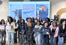 A group of students holding certificates. 