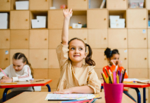 child raising hand