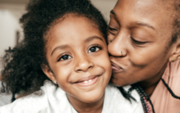 Smiling Mom and Daughter