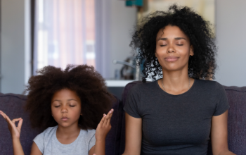 Mom and Daughter doing mediative breathing