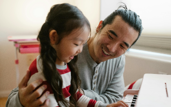 Daughter and Dad playing piano