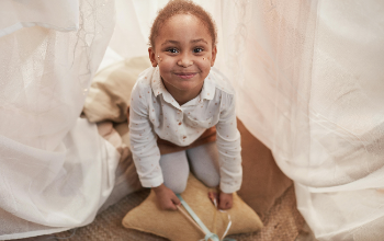 Little Girl in a Fort